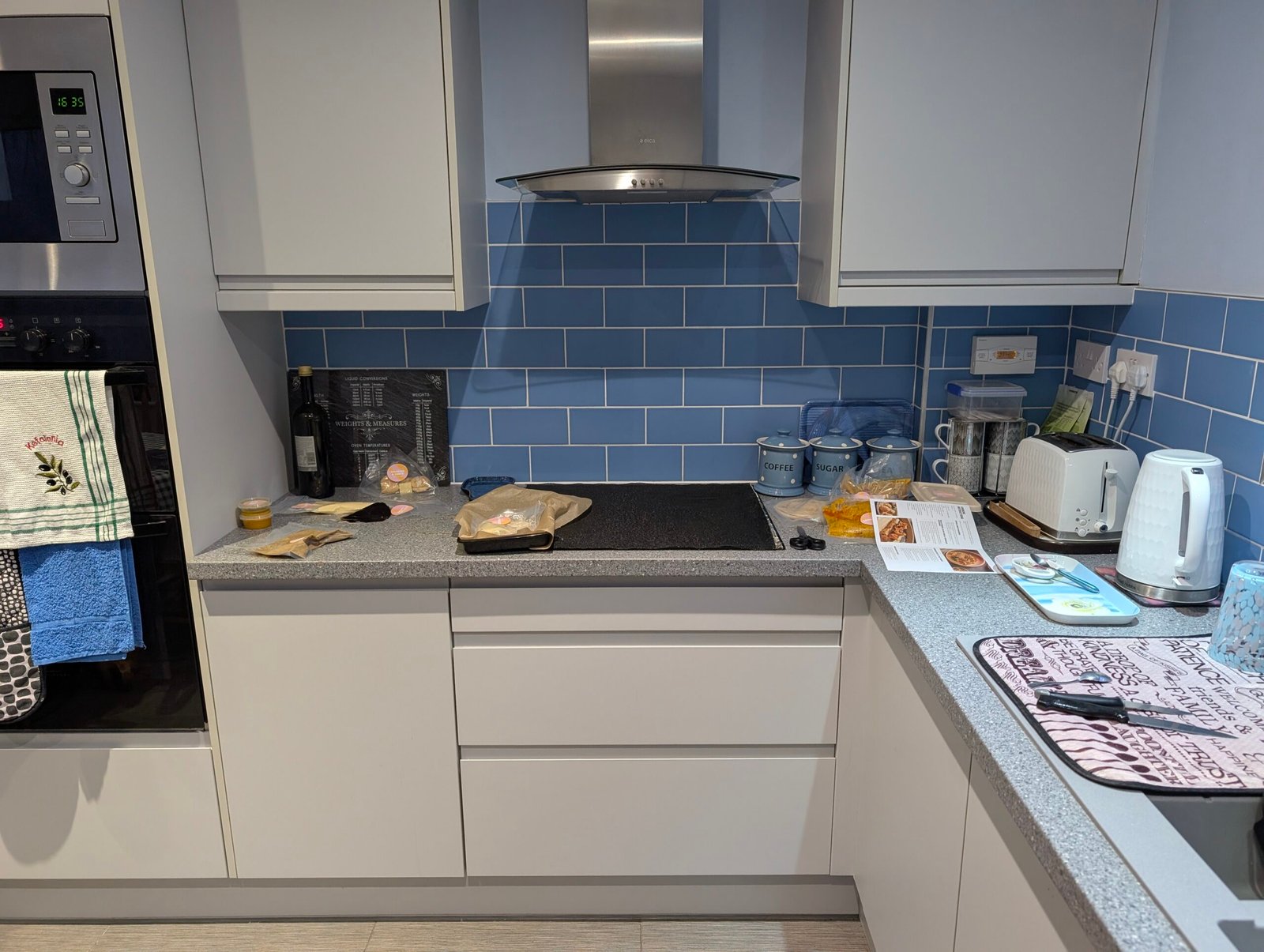 Before: grey laminate worktop and hob run